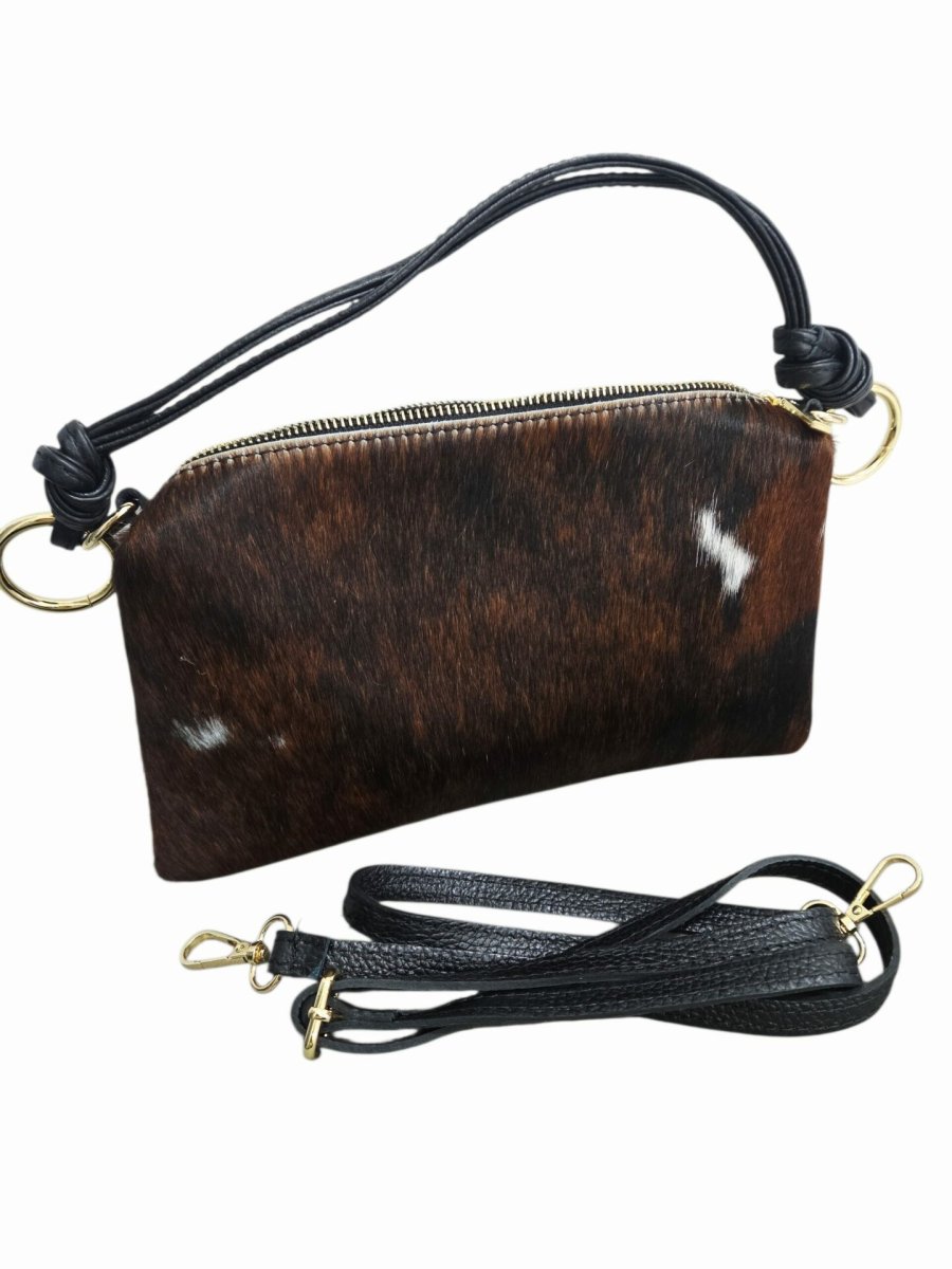 Borsa in vera pelle nera e cavallino muccato,made Italy, manico ampio e tracolla,interno foderato con tasca laterale,chiusura con zip
Misure L27 H15
